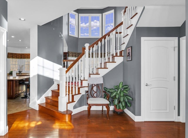 stairway featuring hardwood / wood-style flooring