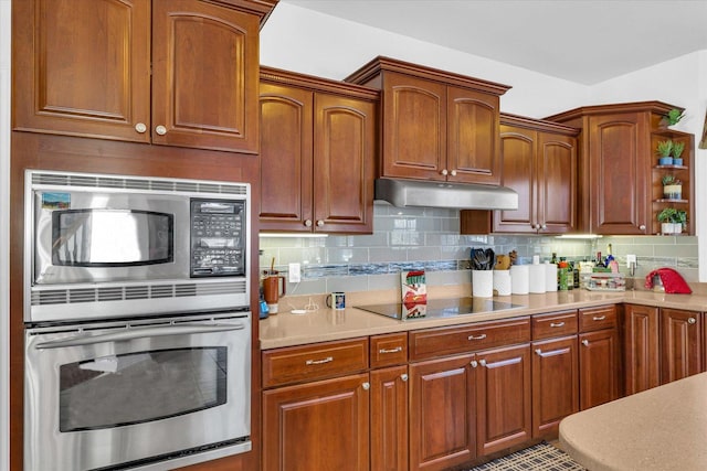 kitchen with decorative backsplash and stainless steel appliances