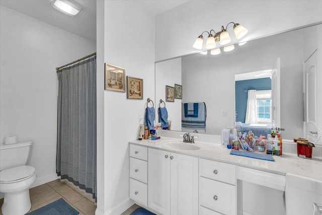 bathroom featuring toilet, vanity, walk in shower, and tile patterned flooring