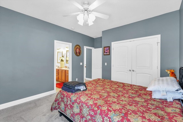 bedroom featuring a closet, ceiling fan, connected bathroom, and carpet floors