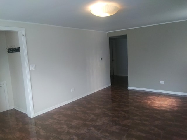 empty room featuring ornamental molding