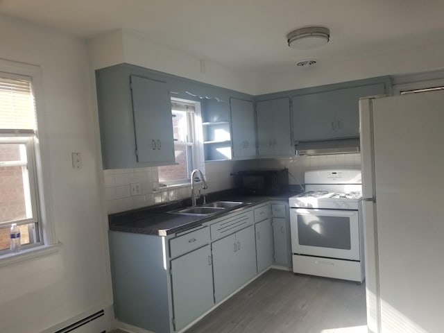 kitchen featuring white appliances, backsplash, and gray cabinets