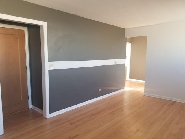 spare room with light hardwood / wood-style floors