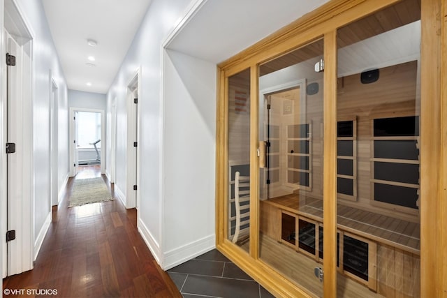 hallway with dark wood-type flooring