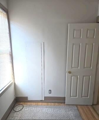 unfurnished bedroom featuring baseboards and light wood finished floors