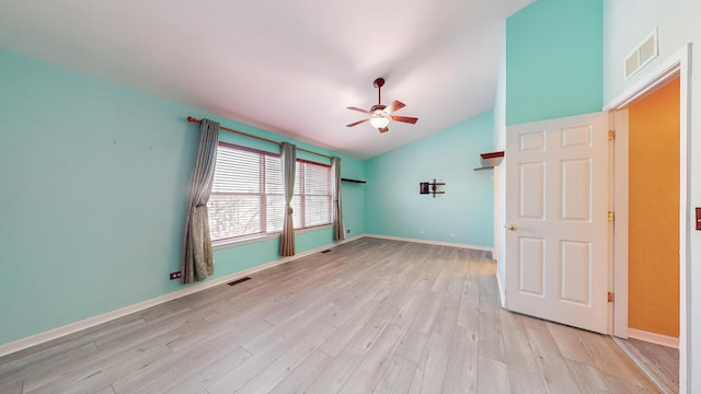 unfurnished room featuring ceiling fan, lofted ceiling, and light wood-type flooring