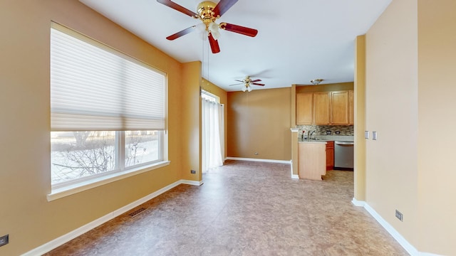 unfurnished living room featuring sink