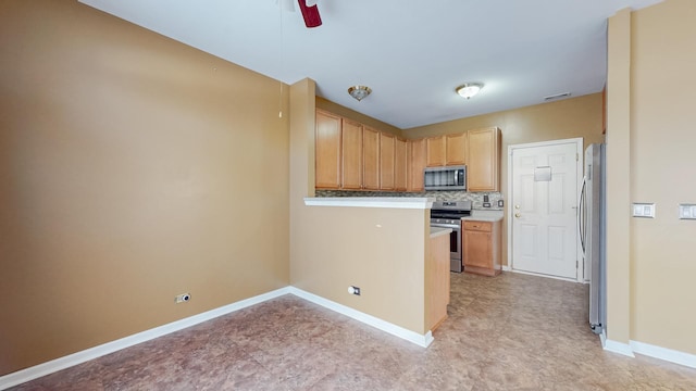 kitchen with tasteful backsplash, light brown cabinetry, ceiling fan, and appliances with stainless steel finishes