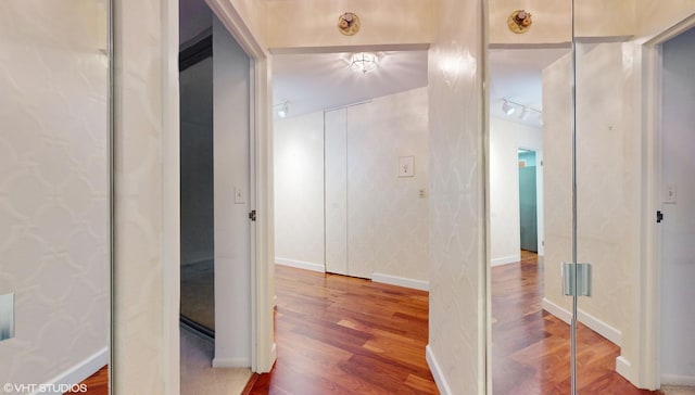 corridor with wood-type flooring