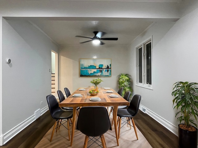 dining room featuring hardwood / wood-style floors, ceiling fan, and crown molding