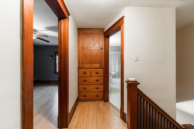 hall with light hardwood / wood-style floors