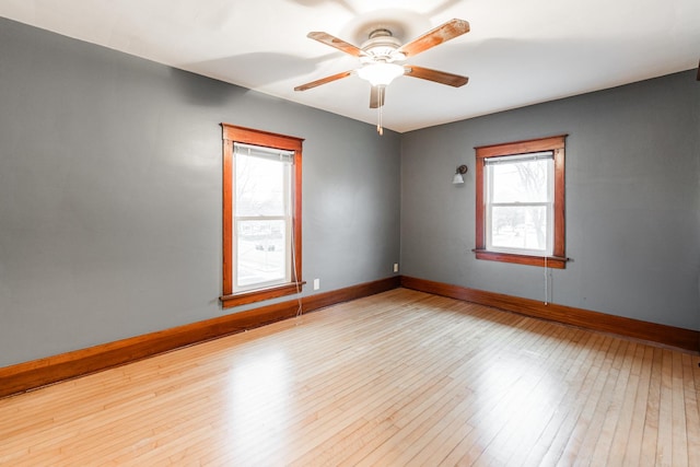 unfurnished room with ceiling fan and light hardwood / wood-style floors