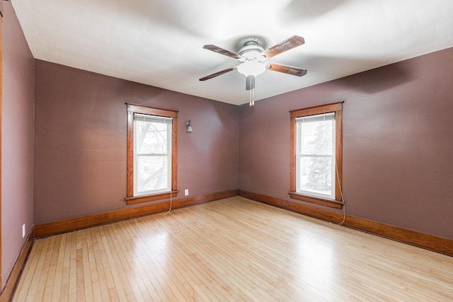 unfurnished room with ceiling fan and light hardwood / wood-style floors