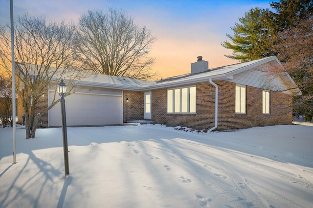 single story home with a garage