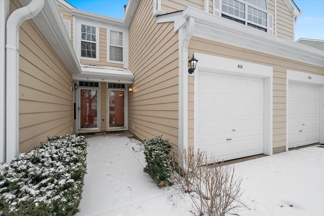 view of snow covered property entrance