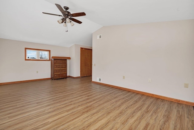 unfurnished living room with light hardwood / wood-style flooring, ceiling fan, and lofted ceiling