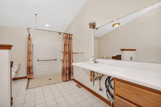 bathroom with tile patterned flooring, curtained shower, and toilet