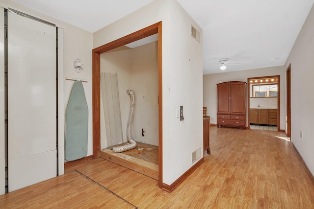 hallway featuring light wood-type flooring