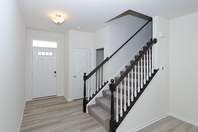 foyer with light wood-type flooring