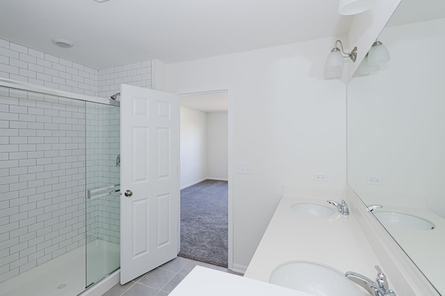 bathroom featuring tile patterned flooring, vanity, and an enclosed shower