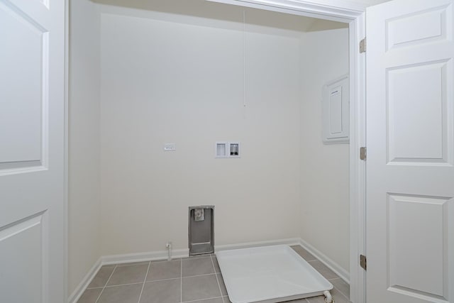 laundry area with hookup for a gas dryer, light tile patterned floors, and hookup for a washing machine