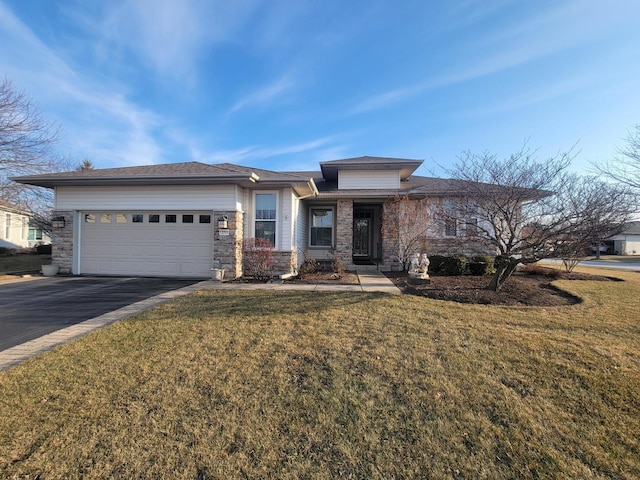 prairie-style home with a front lawn and a garage