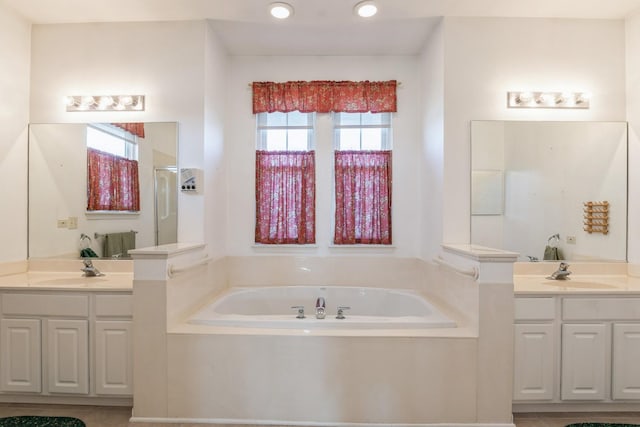 bathroom featuring plus walk in shower and vanity