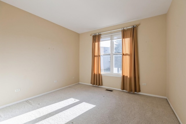 spare room with light carpet