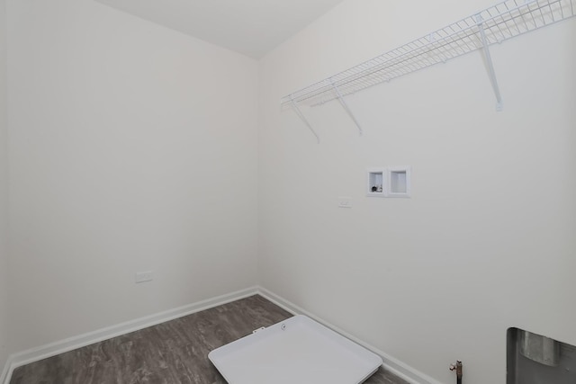 clothes washing area featuring washer hookup, hookup for a gas dryer, and hardwood / wood-style floors