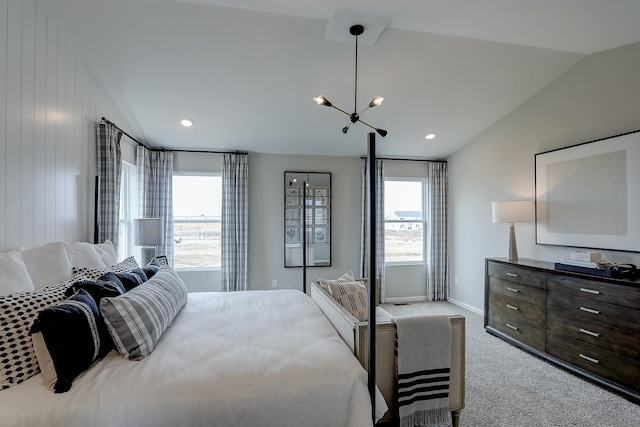 carpeted bedroom with lofted ceiling and a chandelier