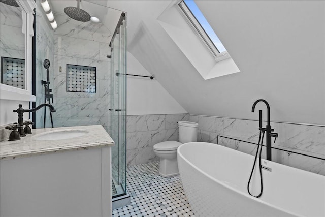 full bathroom with vaulted ceiling with skylight, vanity, tile walls, toilet, and plus walk in shower