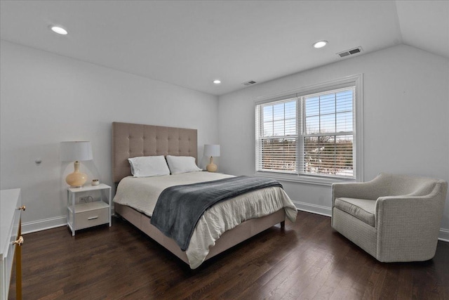 bedroom with dark hardwood / wood-style flooring and lofted ceiling