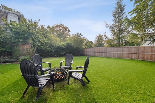 view of yard with a fire pit