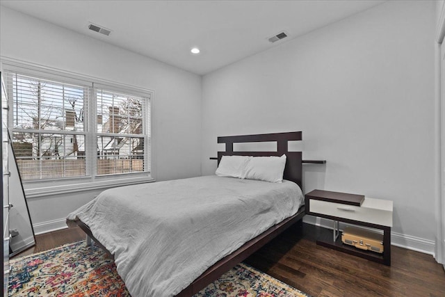 bedroom featuring dark hardwood / wood-style floors