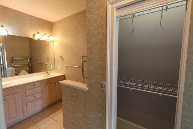 bathroom with tile patterned flooring and vanity