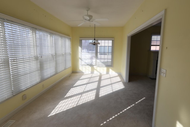 interior space with ceiling fan