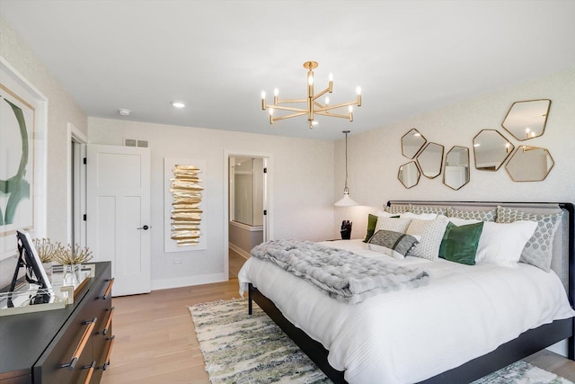 bedroom featuring a chandelier and light wood-type flooring