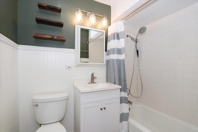 full bathroom featuring vanity, toilet, and shower / tub combo with curtain