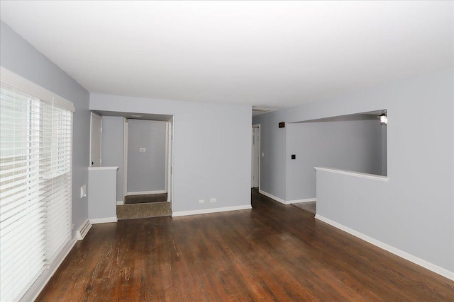 empty room featuring dark hardwood / wood-style flooring