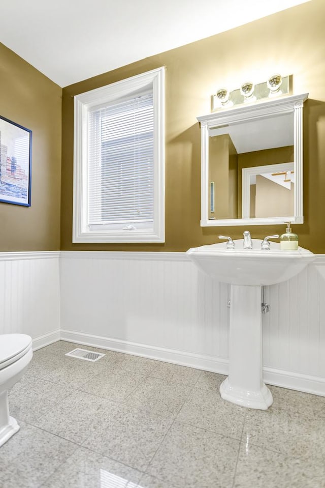 bathroom featuring toilet and sink