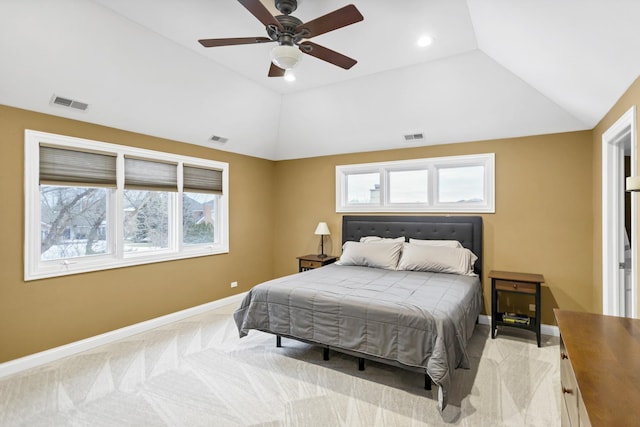 carpeted bedroom with ceiling fan and lofted ceiling