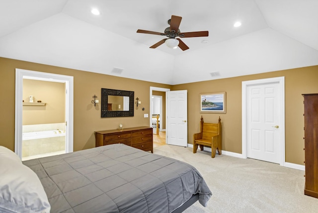 carpeted bedroom featuring ceiling fan, vaulted ceiling, and ensuite bathroom