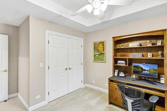 office featuring ceiling fan and light carpet