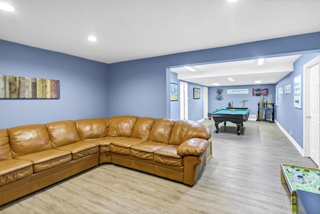 living room featuring light wood-type flooring and pool table