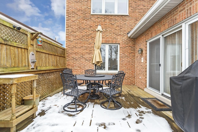 snow covered deck with grilling area