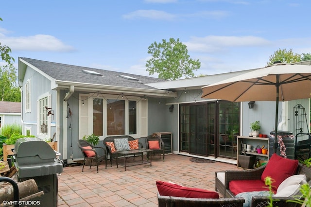 back of house featuring an outdoor living space and a patio