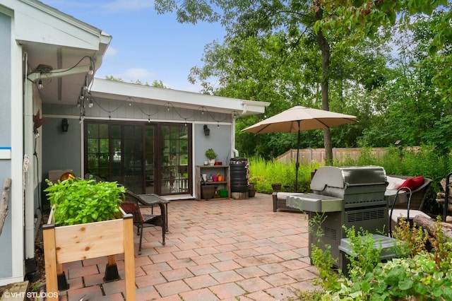 view of patio featuring a grill