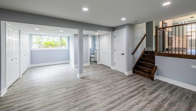 basement featuring hardwood / wood-style floors