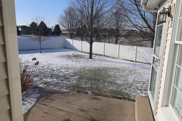 view of yard layered in snow