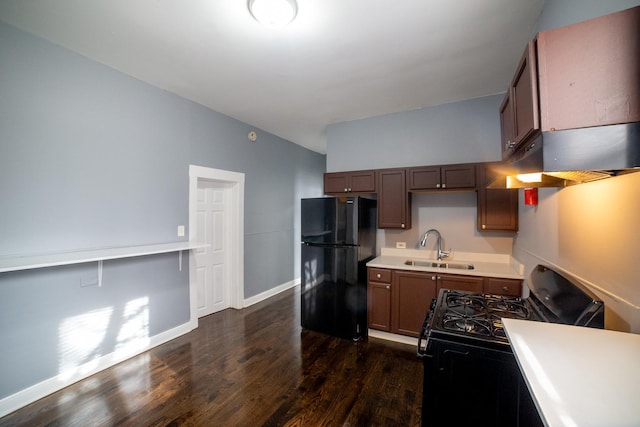 kitchen with sink, dark wood-type flooring, and black appliances